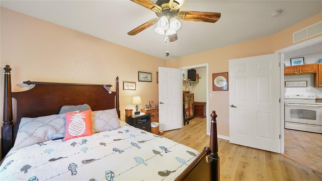 bedroom with light wood-type flooring and ceiling fan