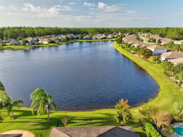 drone / aerial view featuring a residential view and a water view