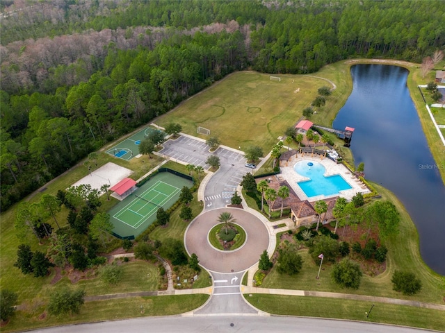 aerial view featuring a water view and a view of trees