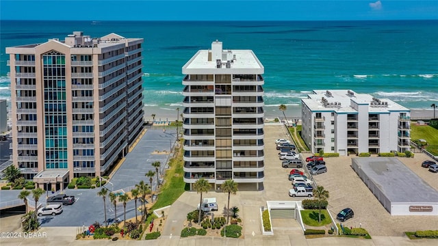 aerial view featuring a water view and a view of the beach