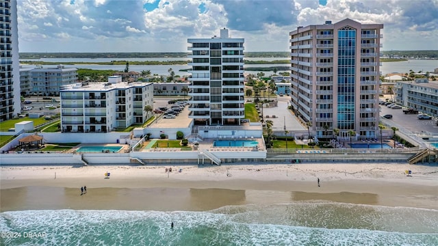 exterior space featuring a view of the beach and a water view