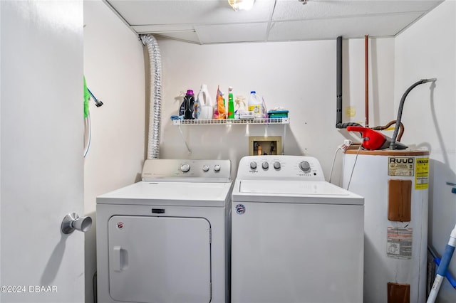 laundry area featuring water heater and washer and dryer