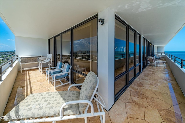 balcony featuring a water view