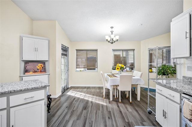 50 Florida Park Dr, Palm Coast, FL 32137 - dining space with a chandelier and dark wood-type flooring