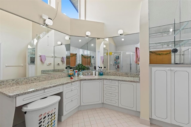 50 Florida Park Dr, Palm Coast, FL 32137 - bathroom with a shower stall, tile patterned floors, vanity, and a high ceiling