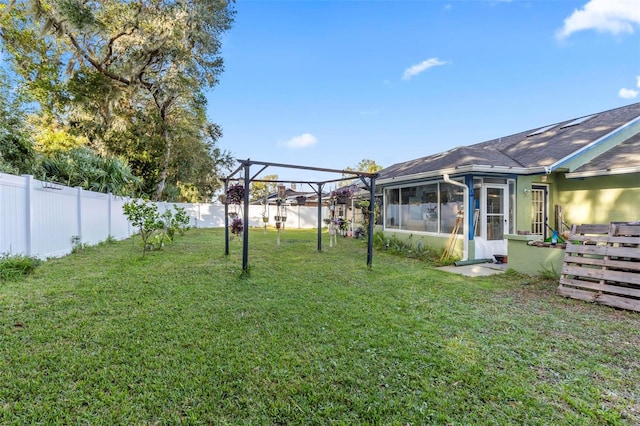 50 Florida Park Dr, Palm Coast, FL 32137 - fenced backyard featuring a sunroom