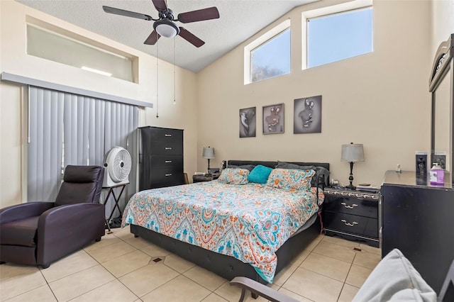 bedroom featuring ceiling fan, light tile patterned floors, high vaulted ceiling, and a textured ceiling