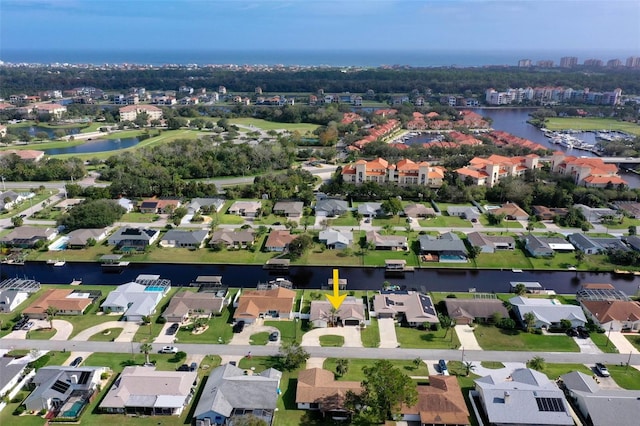 birds eye view of property with a water view