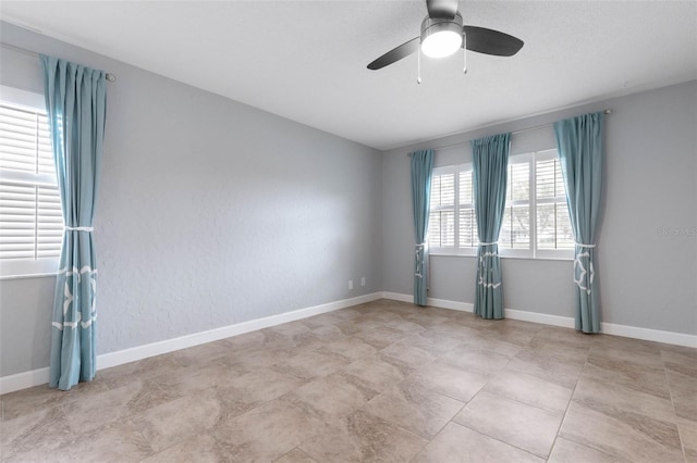 empty room featuring ceiling fan