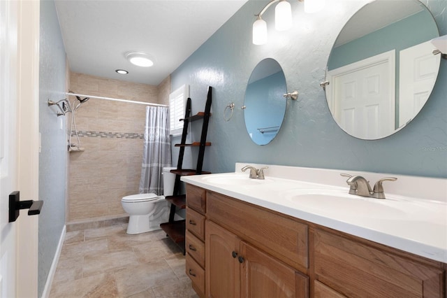 bathroom with walk in shower, vanity, and toilet