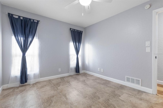 unfurnished room featuring ceiling fan