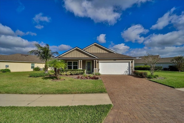 view of front of house with a front yard and a garage