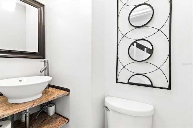 bathroom featuring sink and toilet