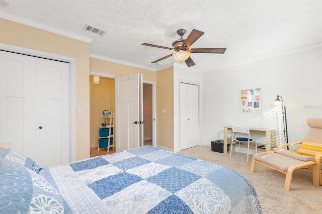 bedroom with light carpet, a textured ceiling, ceiling fan, and ornamental molding