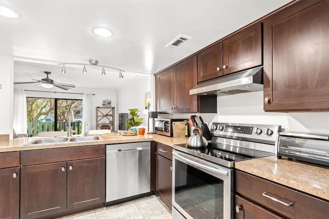 kitchen with dark brown cabinetry, ceiling fan, sink, rail lighting, and stainless steel appliances