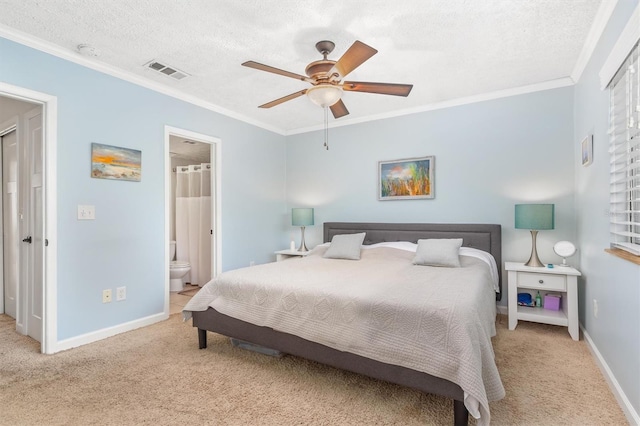 bedroom with ensuite bathroom, ceiling fan, crown molding, and light colored carpet