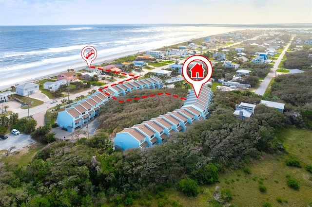 bird's eye view with a view of the beach and a water view