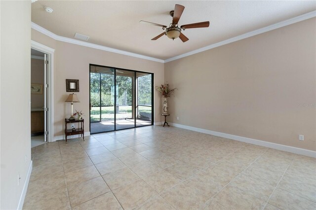 empty room with ceiling fan, light tile patterned flooring, and crown molding