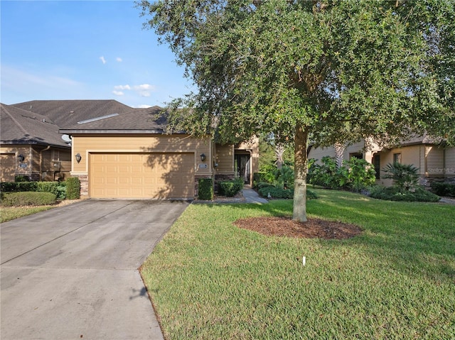 view of front of property with a garage and a front yard