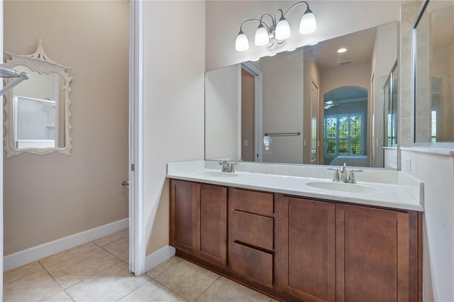 bathroom with tile patterned flooring, ceiling fan, and vanity