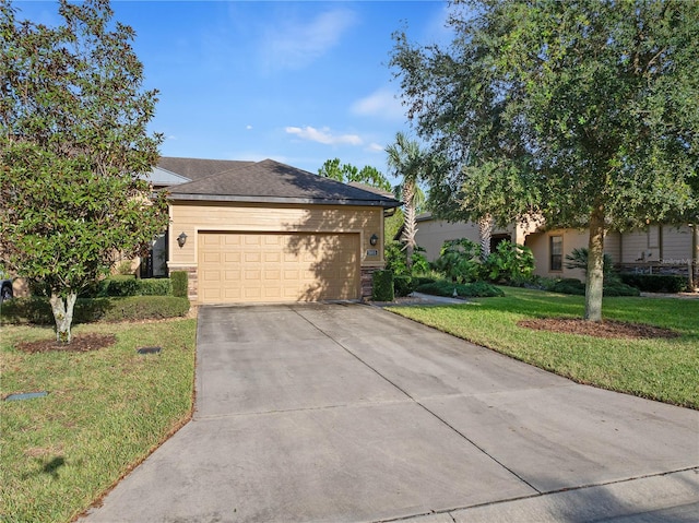 view of front facade featuring a garage and a front yard