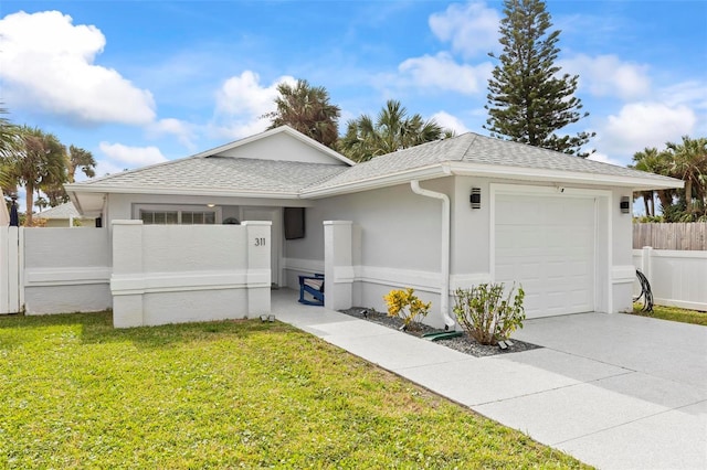 ranch-style home with a front lawn and a garage