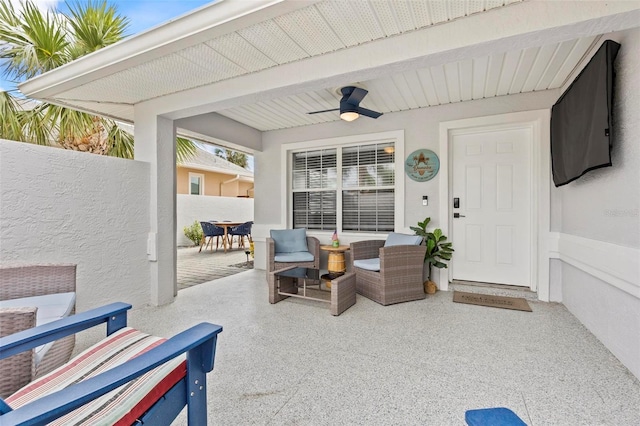 exterior space with ceiling fan and a patio area