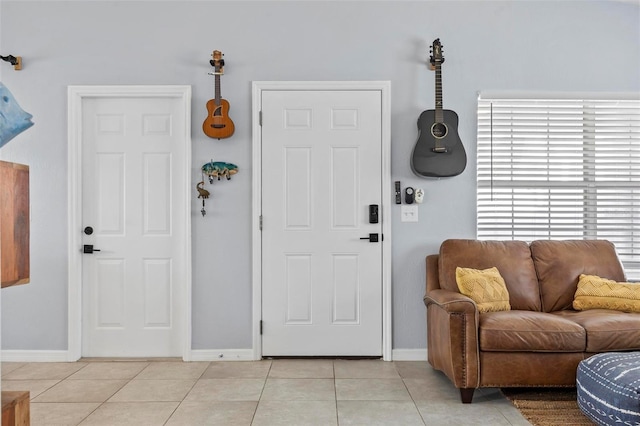 foyer entrance with light tile patterned floors