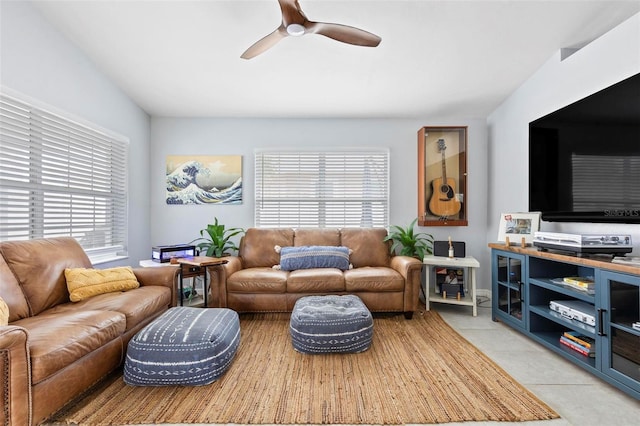 living room featuring light tile patterned floors and ceiling fan