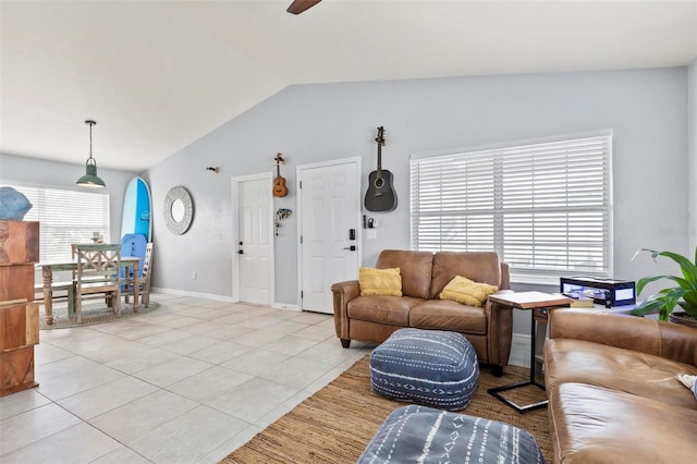 tiled living room featuring vaulted ceiling and ceiling fan