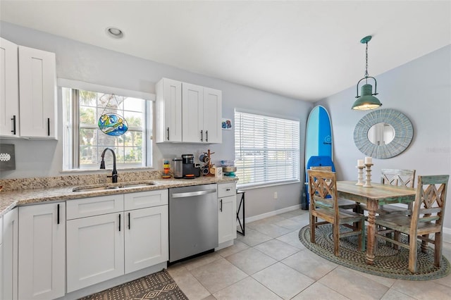 kitchen with dishwasher, plenty of natural light, sink, and white cabinets