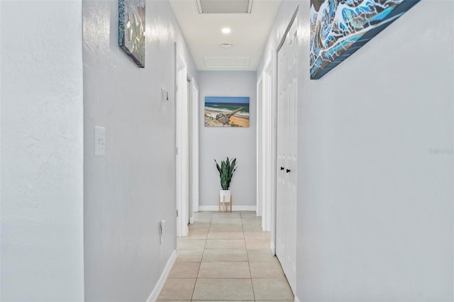 corridor with light tile patterned flooring