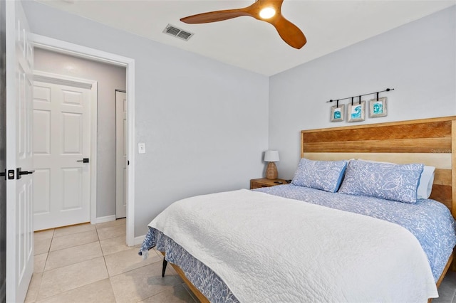 bedroom with tile patterned floors and ceiling fan