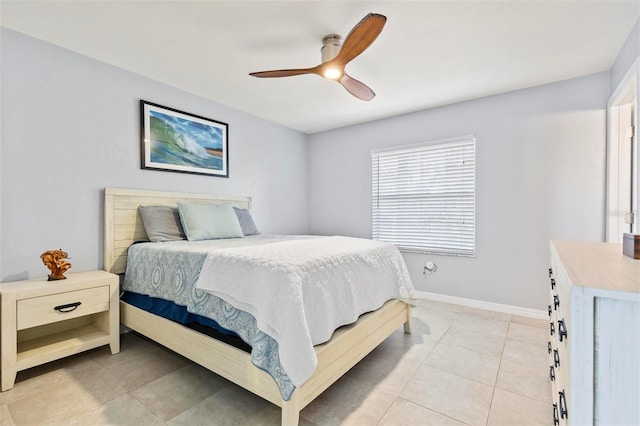 tiled bedroom with ceiling fan