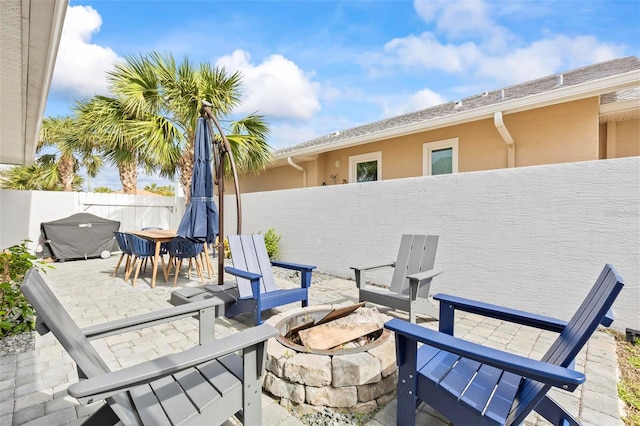 view of patio / terrace with a fire pit