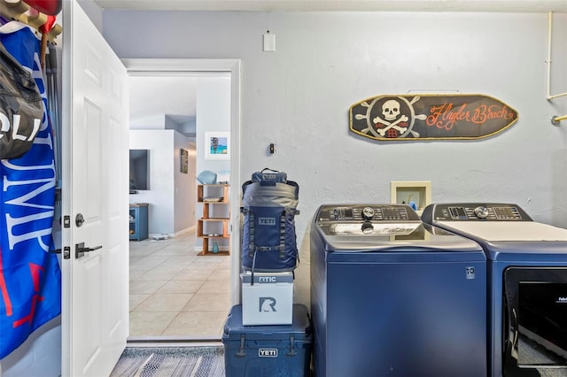 washroom featuring tile patterned floors and separate washer and dryer