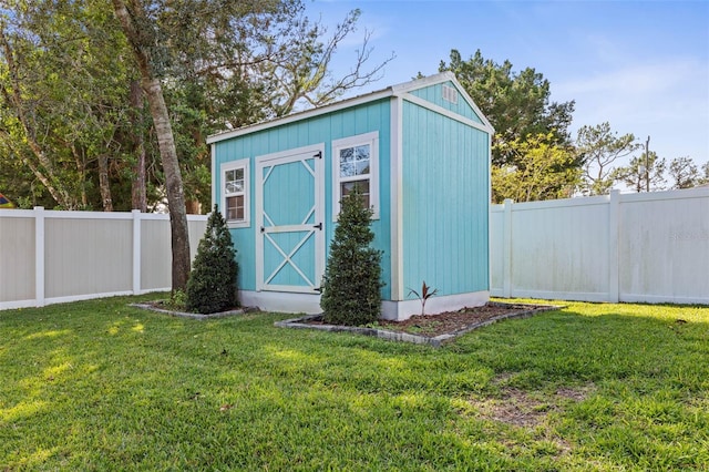 view of outbuilding with a lawn