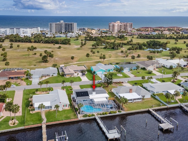 birds eye view of property with a water view