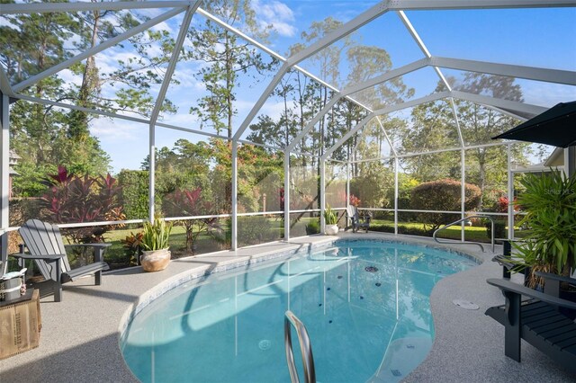 outdoor pool with a lanai and a patio