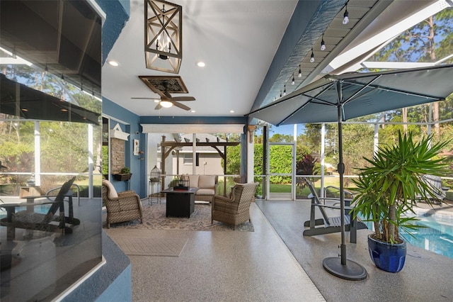 sunroom with a ceiling fan