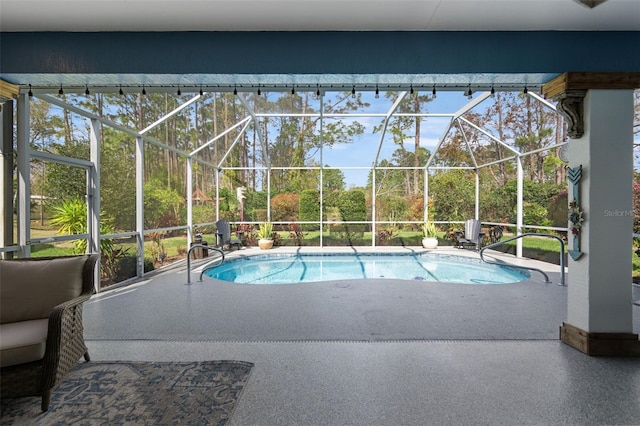 pool with a patio area and glass enclosure