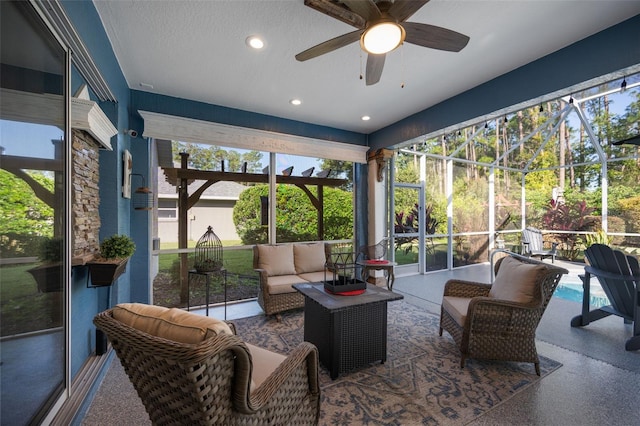 sunroom / solarium with ceiling fan