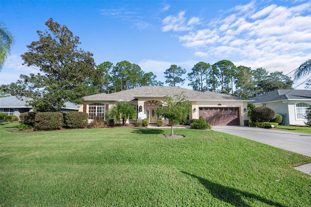 ranch-style home with a garage, a front yard, concrete driveway, and stucco siding