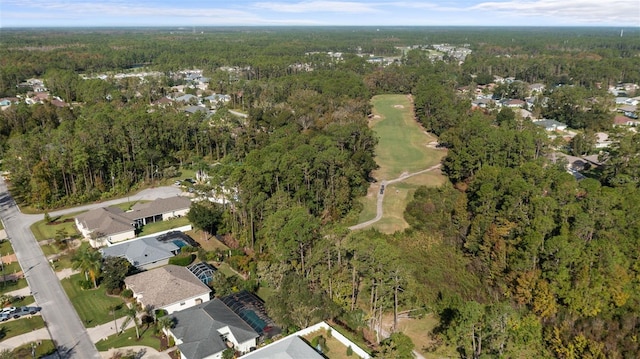 drone / aerial view with a residential view and a wooded view