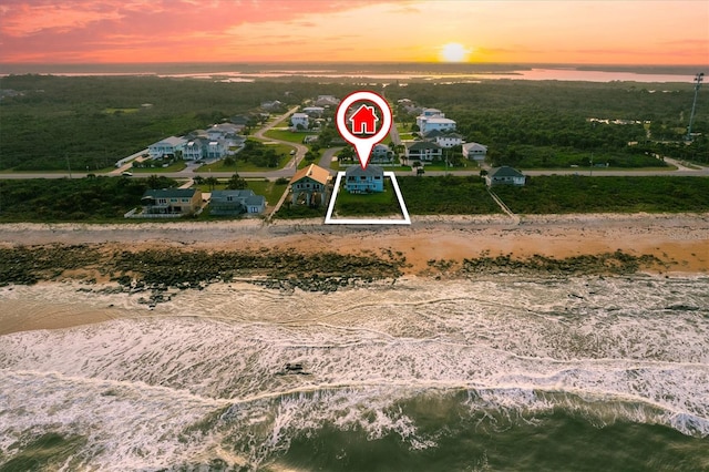 aerial view at dusk with a water view