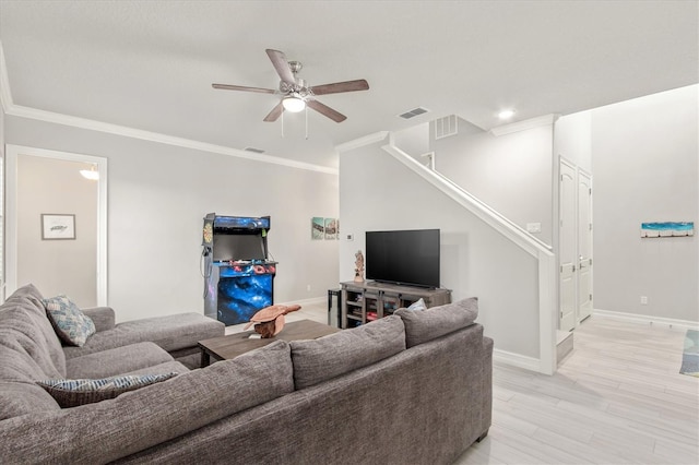 7095 N Ocean Shore Blvd, Palm Coast, FL 32137 - living area featuring stairway, baseboards, a ceiling fan, crown molding, and light wood finished floors