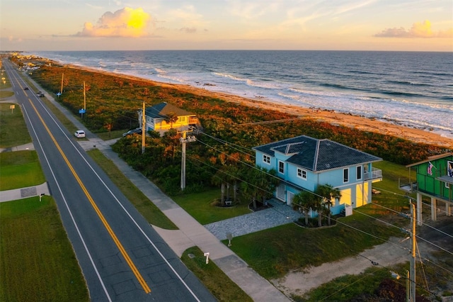 bird's eye view featuring a view of the beach and a water view