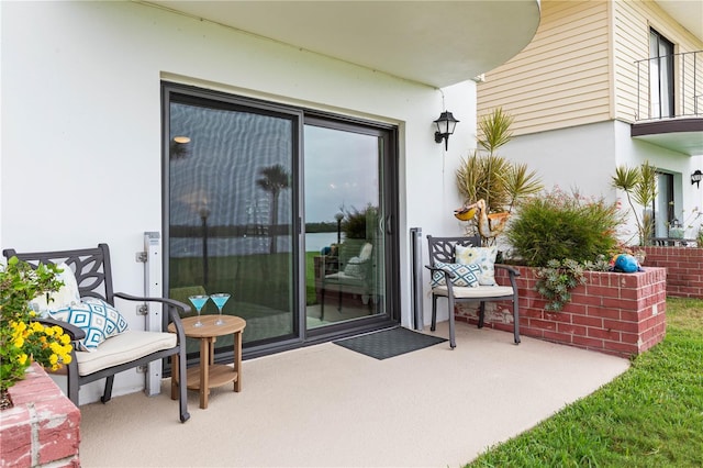 entrance to property with a patio area