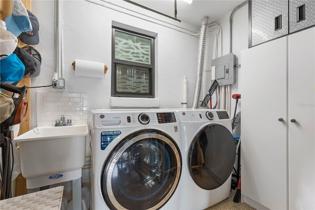 laundry room featuring washer and dryer and sink