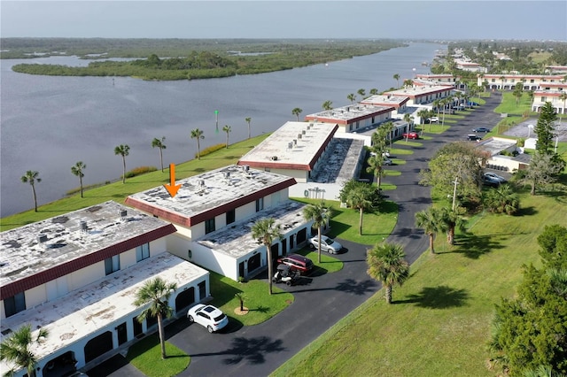 birds eye view of property featuring a water view